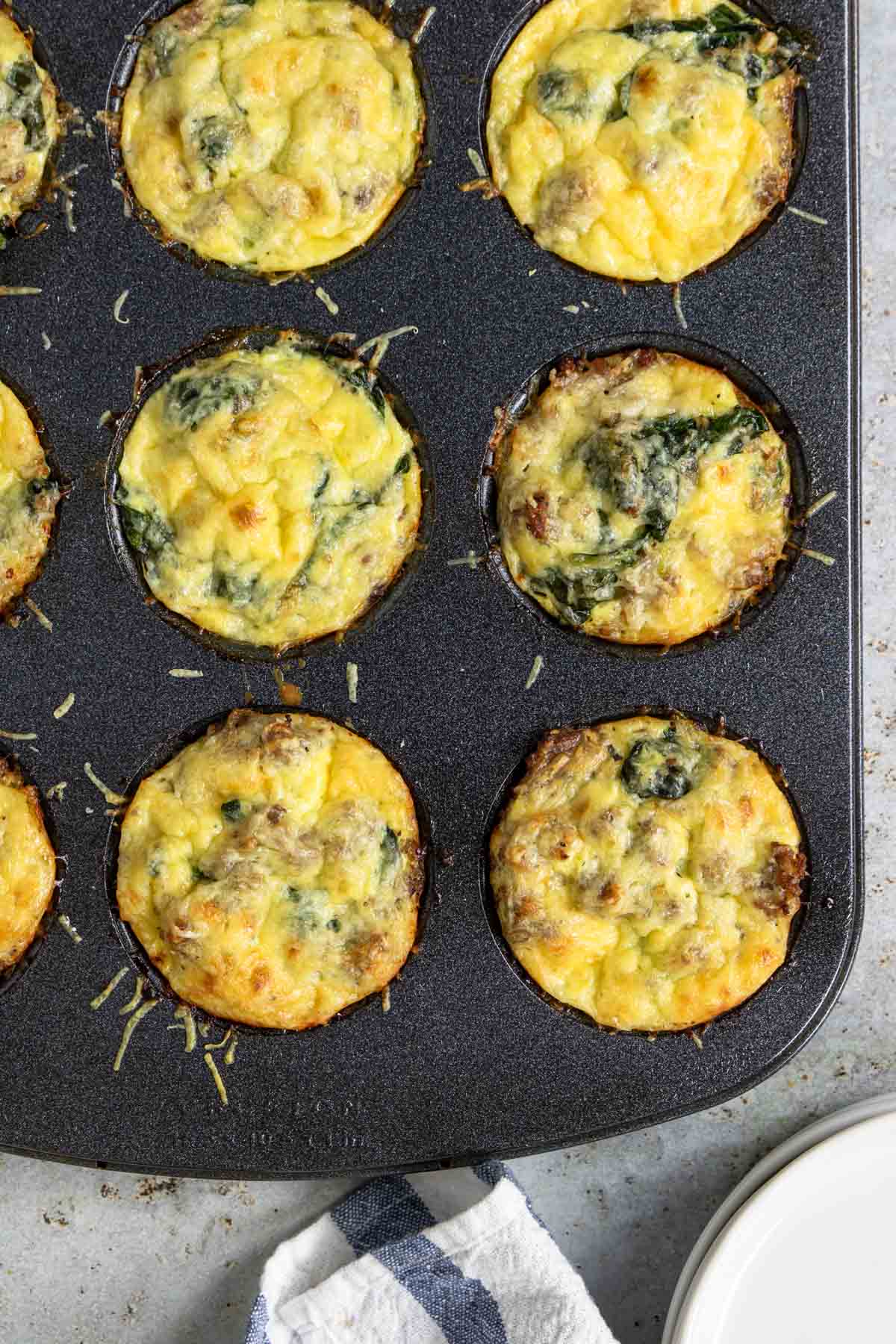 cooked sausage egg cups in a muffin tin