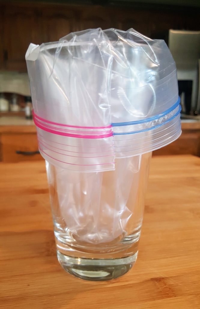 ziplock baggie in a glass used for a piping bag