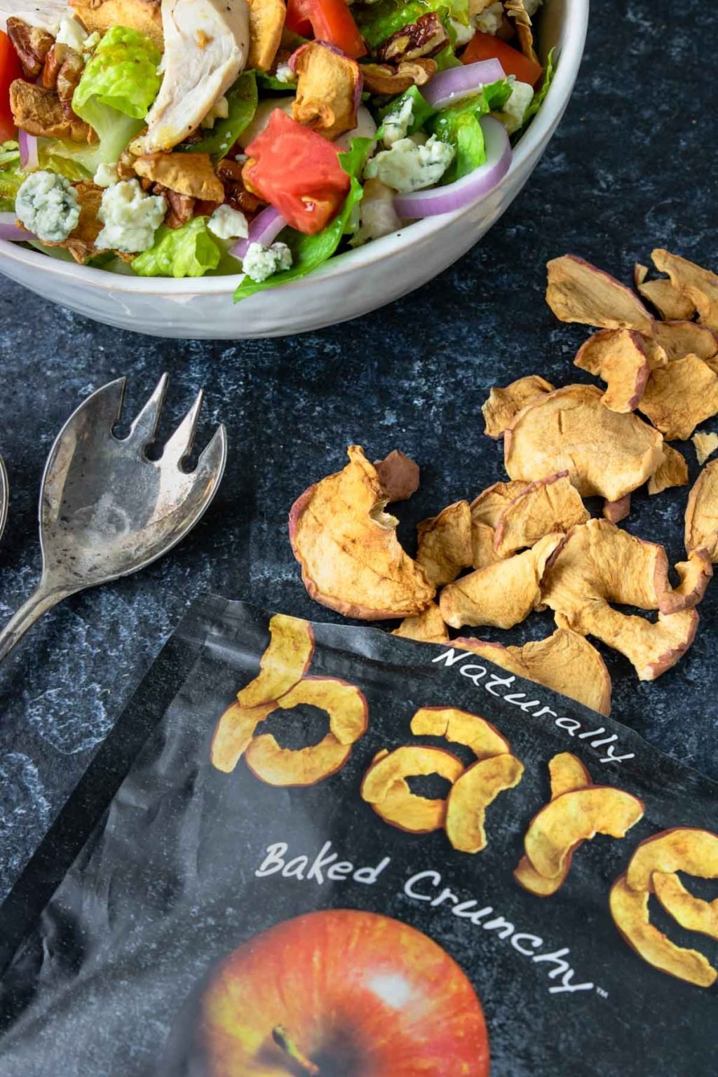 Bare Naked Crispy Apple Chips spilled out of the packaging 