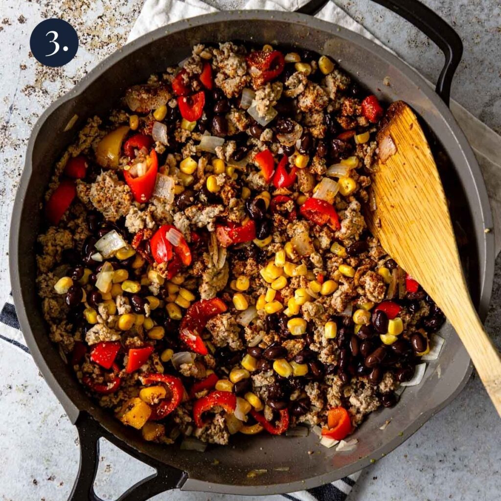 turkey, corn, black beans and spices in a skillet