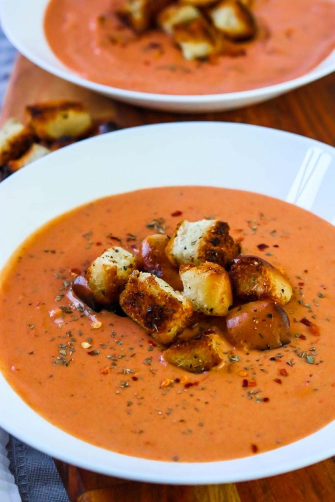 5 Minute Tomato Basil Soup with Garlic Croutons in a white bowl