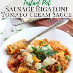 Instant Pot Sausage Rigatoni in a white bowl garnished with parmesan