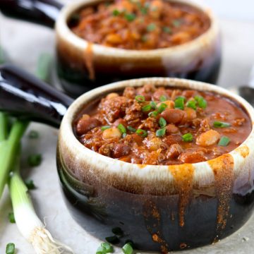Two bowls of Classic Chili with green onions
