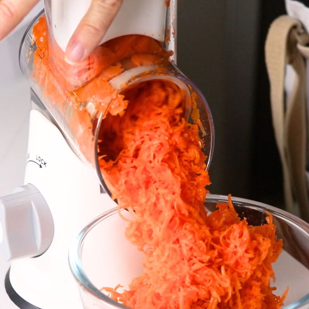 Shredding Carrots with a hand crank shredder