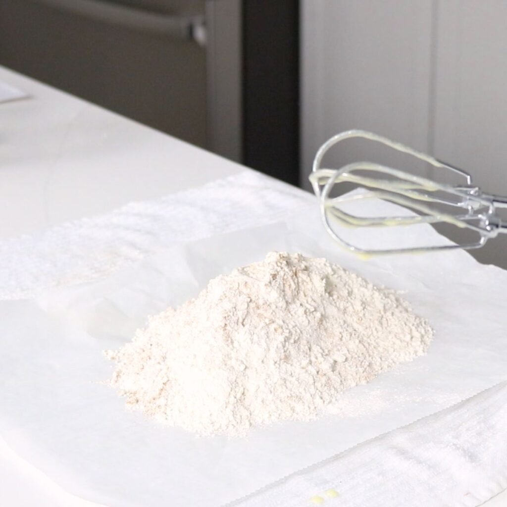 Sifted dry ingredients on a piece of parchment