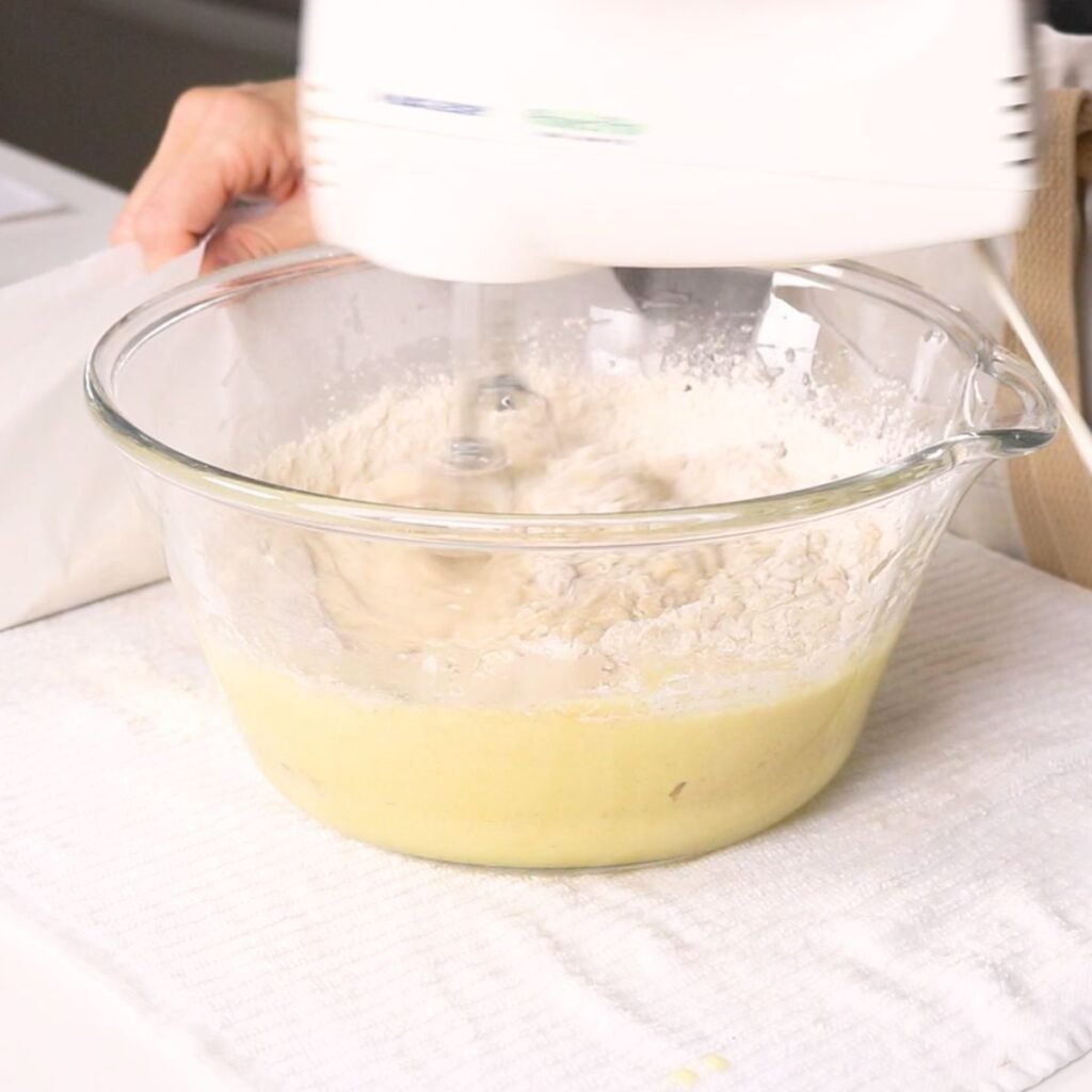 blending carrot cake batter with a hand mixer