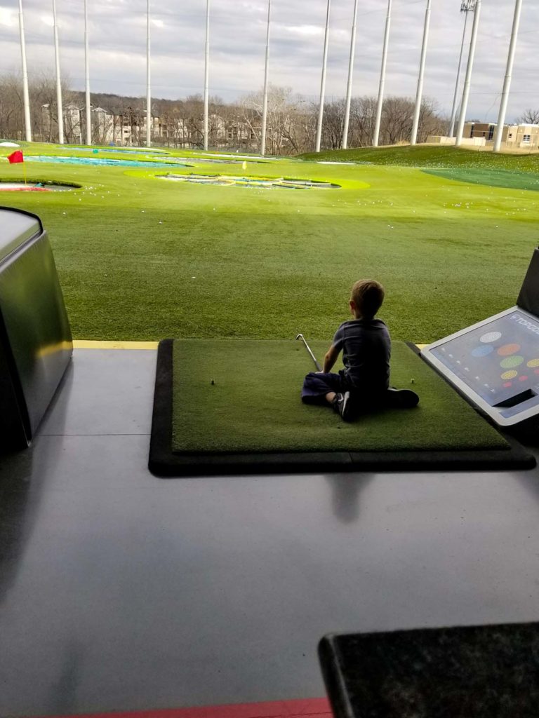 a boy on the golf course