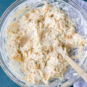 cheesy hash brown casserole mixed in a bowl before baking