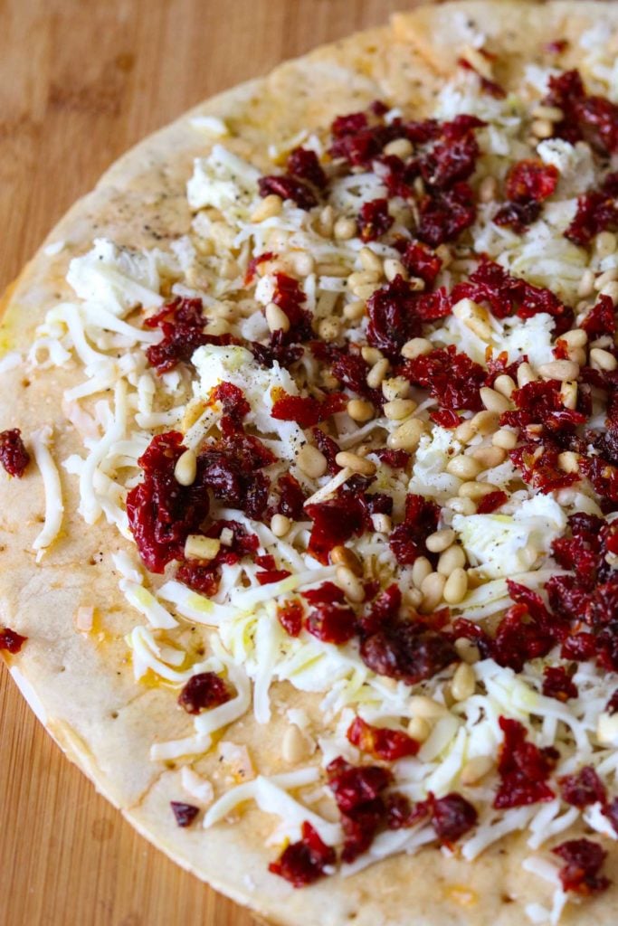 Goat Cheese Pizza with Sun Dried Tomatoes and Pine Nuts  before it gets put into the oven