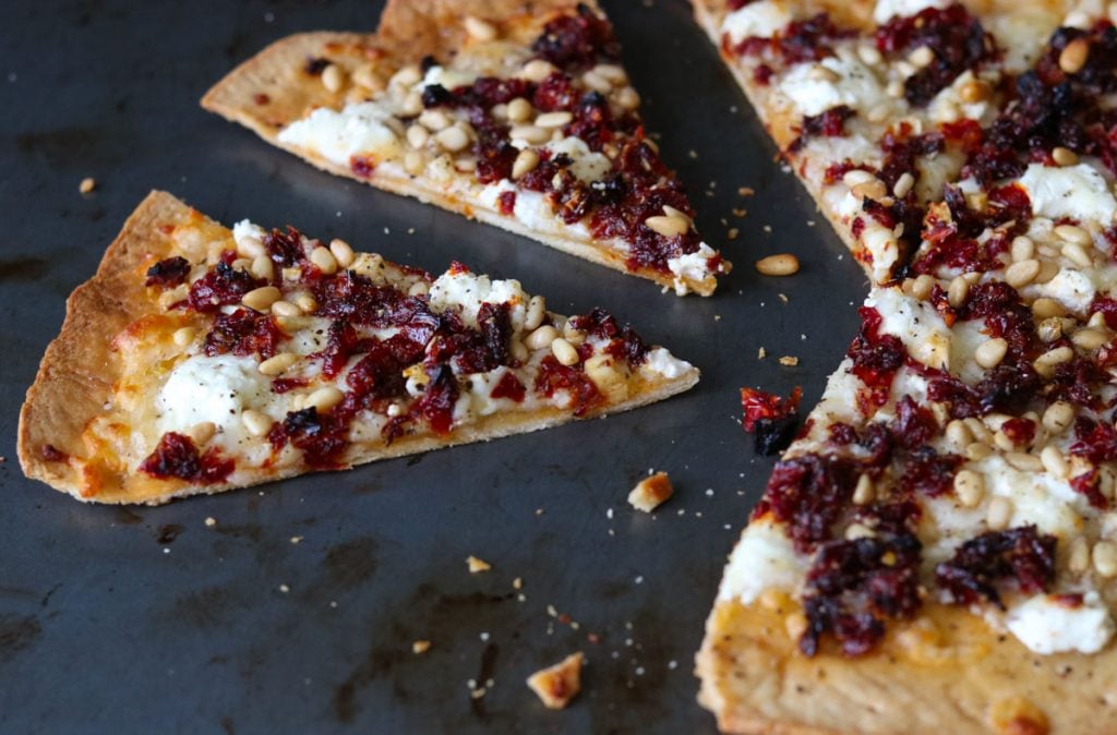 Goat Cheese Pizza with Sun Dried Tomatoes and Pine Nuts  cut into pieces momsdinner.net