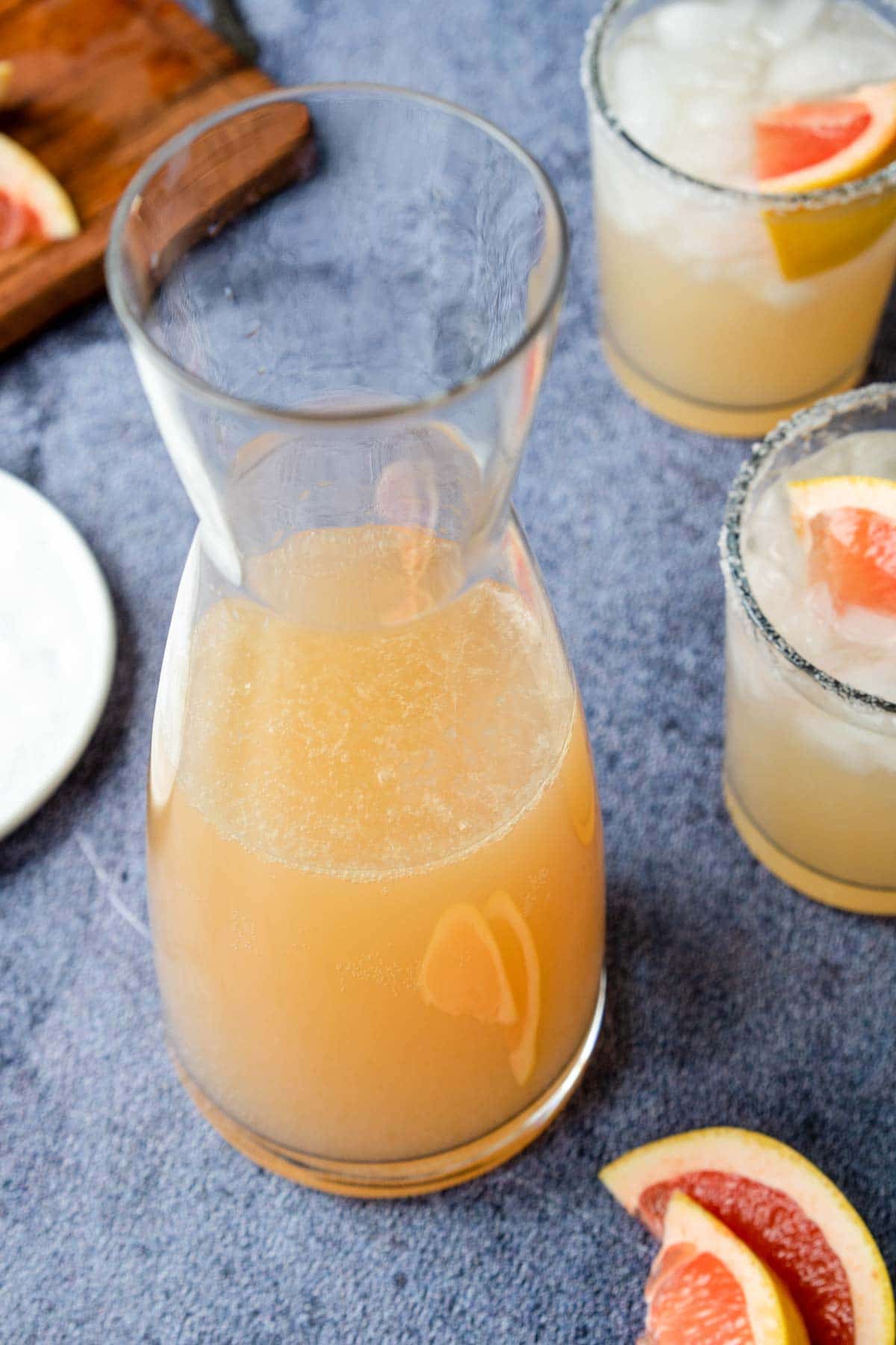 a pitcher filled with grapefruit margarita