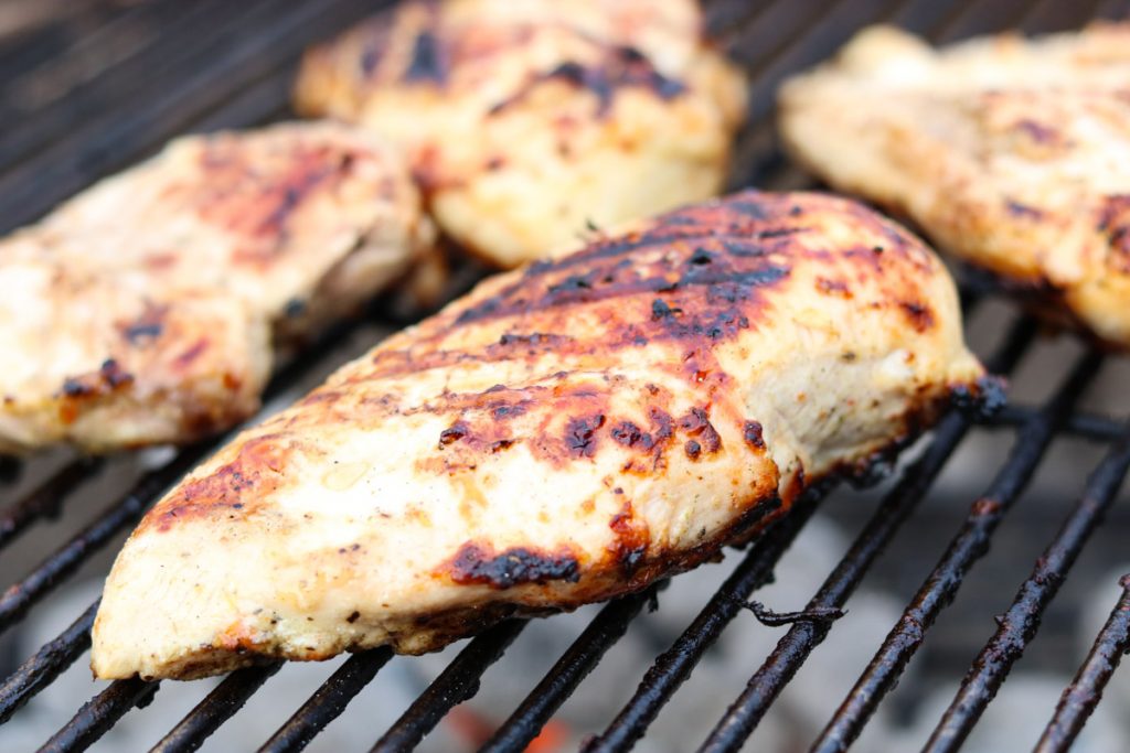 chicken breasts grilling on a charcoal grill momsdinner.net