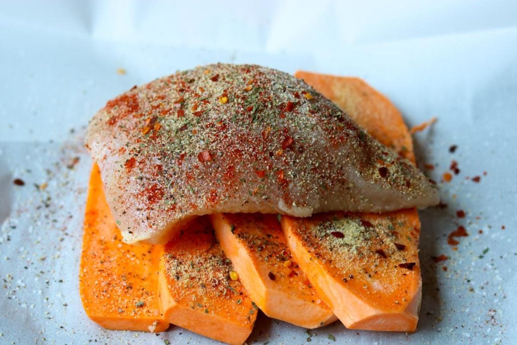 Chicken in Parchment with Sweet Potatoes sprinkled with seasonings