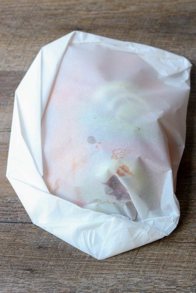 Barbecue Chicken in Parchment with Sweet Potatoes & Peppers - A 30 minute dinner full of flavor and nutrition. via momsdinner.net #chickeninparchment #easydinner #chickendinner #dinnertonight