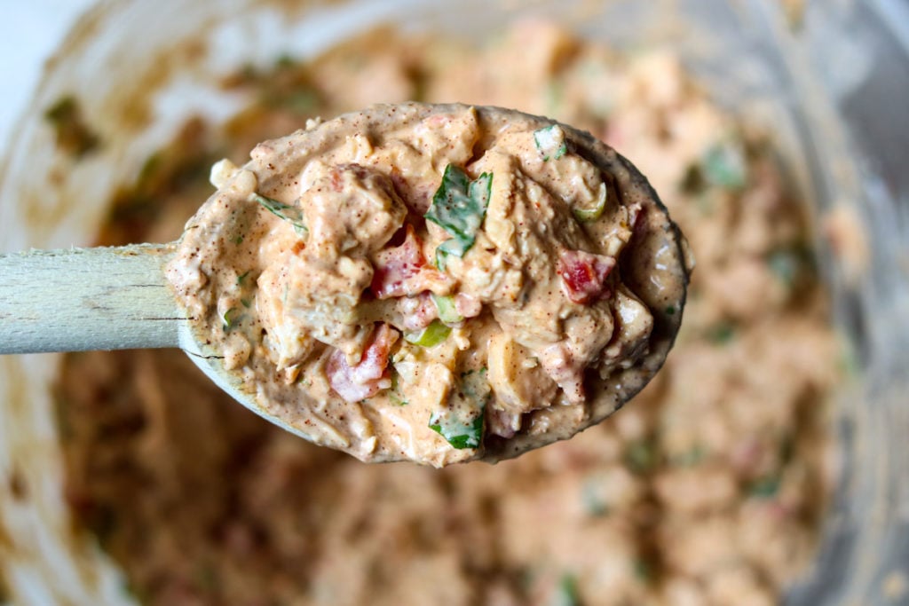 Creamy Chicken Taco mixture on a wooden spoon