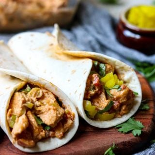 two chicken tacos in flour tortillas