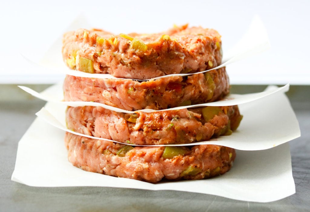 four raw turkey patties