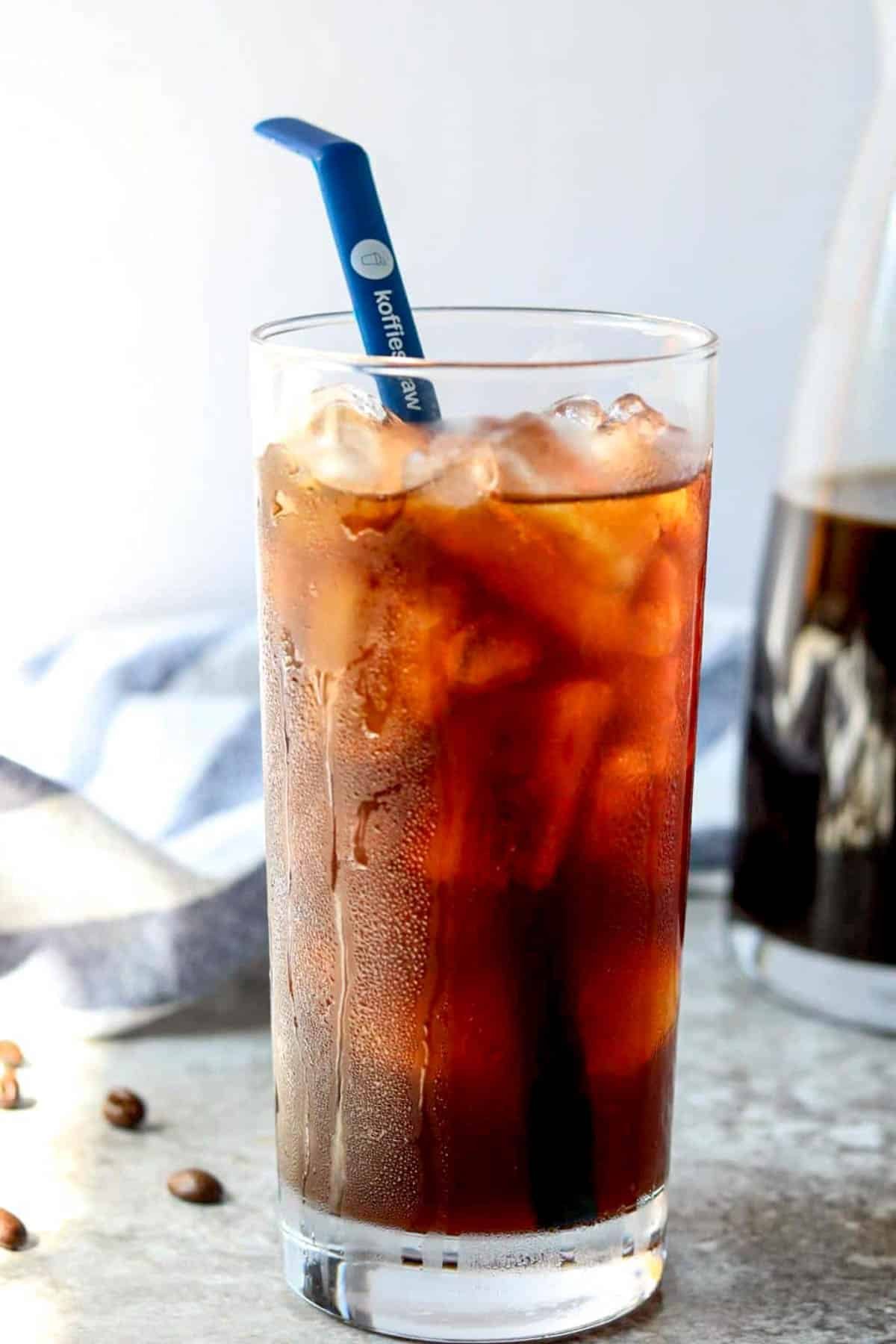 iced coffee in a glass with a straw 
