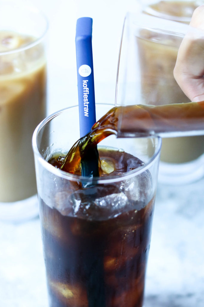 iced coffee being poured over ice