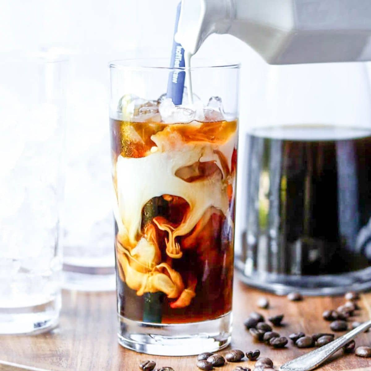 cold brew coffee with milk being added