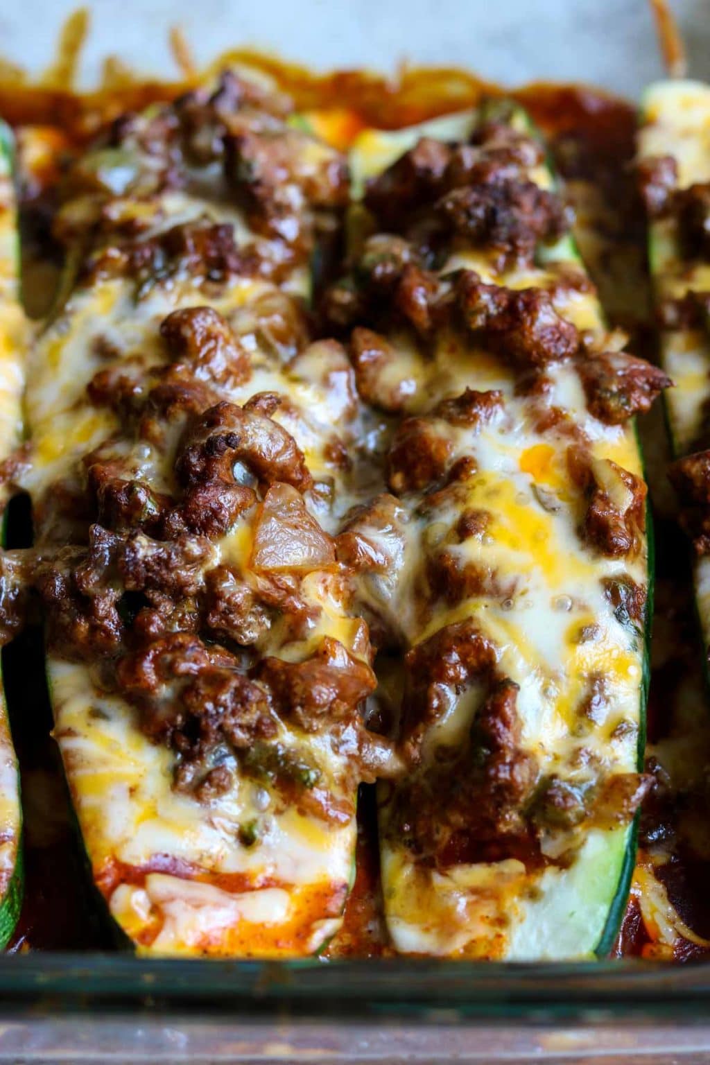 Zucchini Enchilada Boats topped with cheese and beef