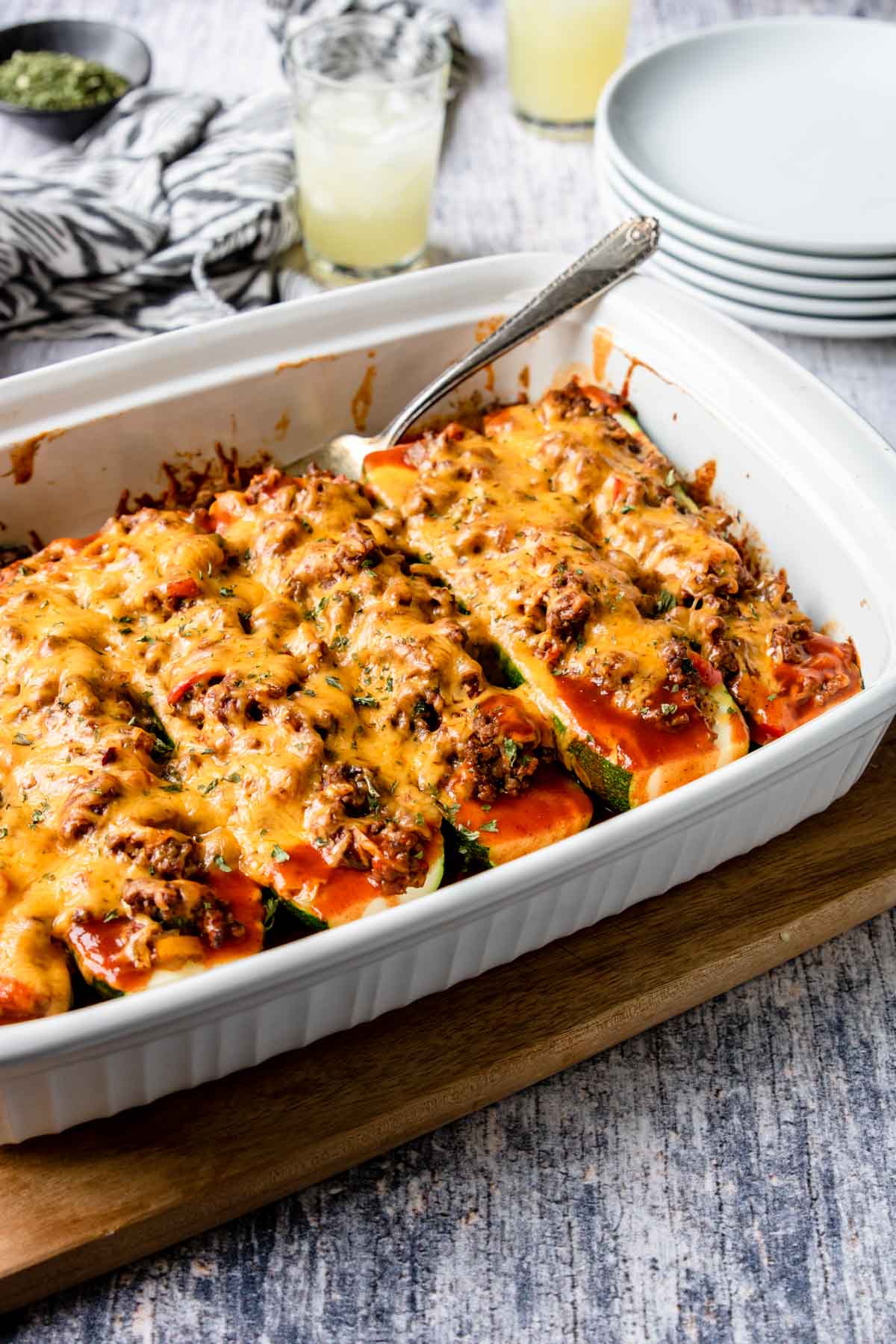 zucchini enchiladas in a white casserole pan