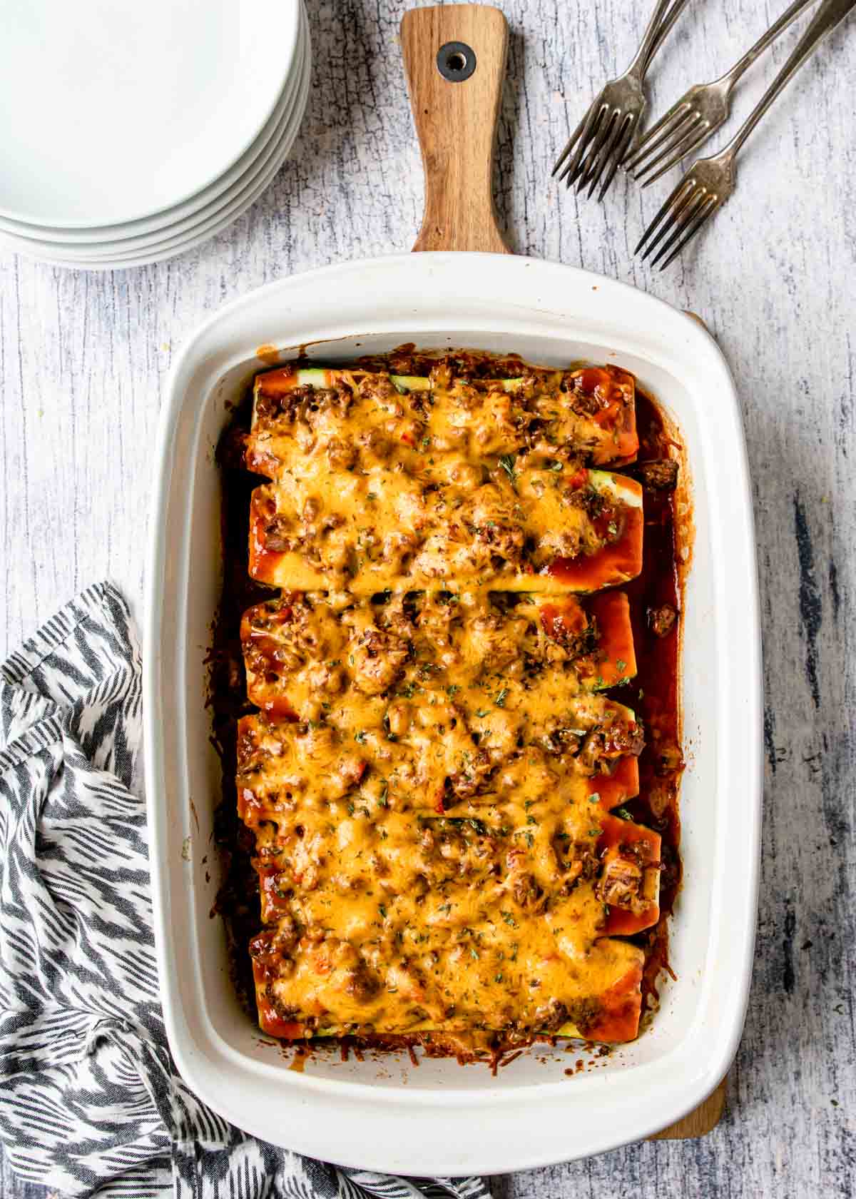 a casserole dish with enchiladas make with zucchinis