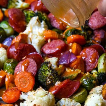 Smoked Sausage Sheet Pan Dinner with Veggies, and smoked paprika vinaigrette drizzled over top