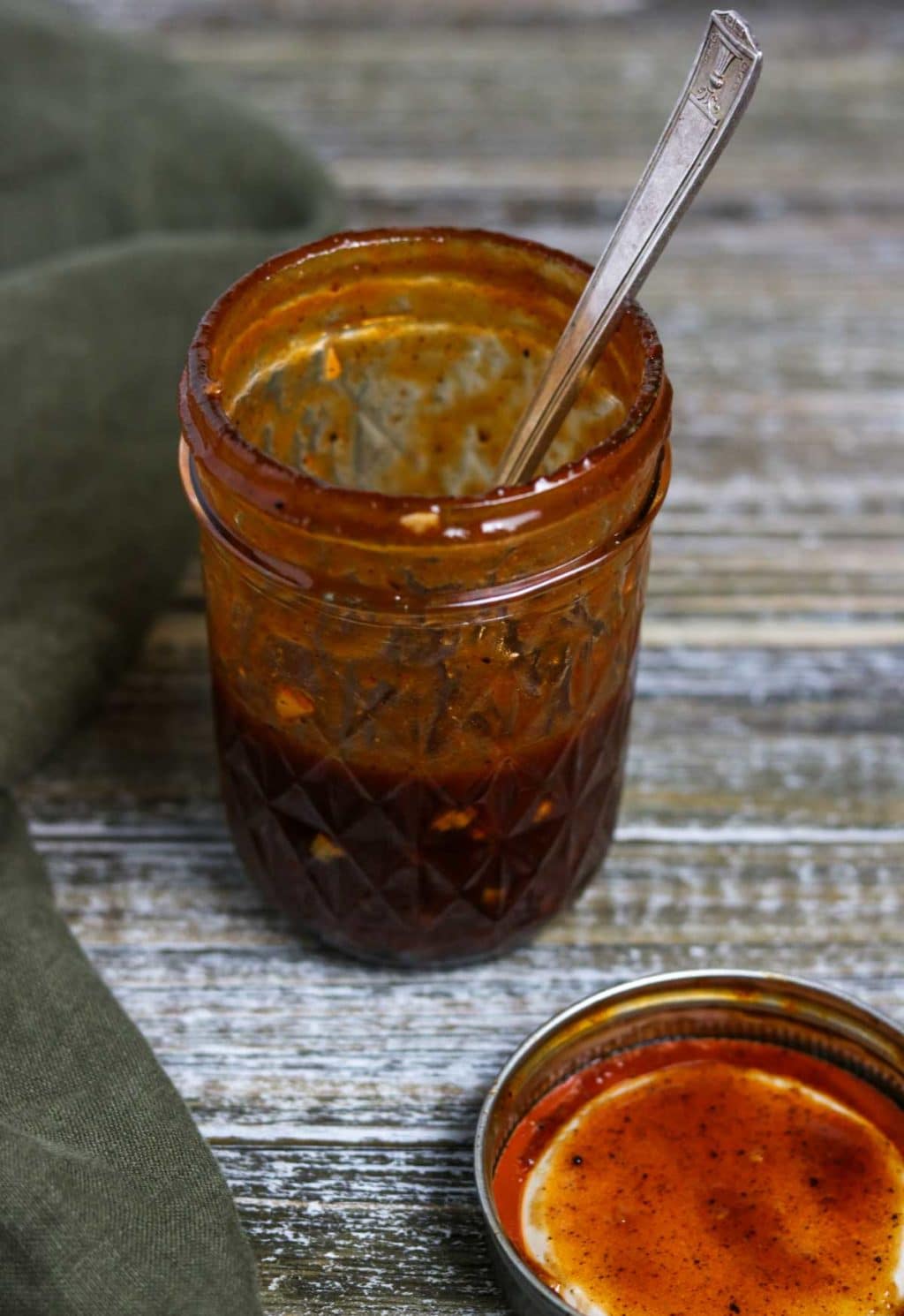 BBQ Vinaigrette in a mason jar with a spoon