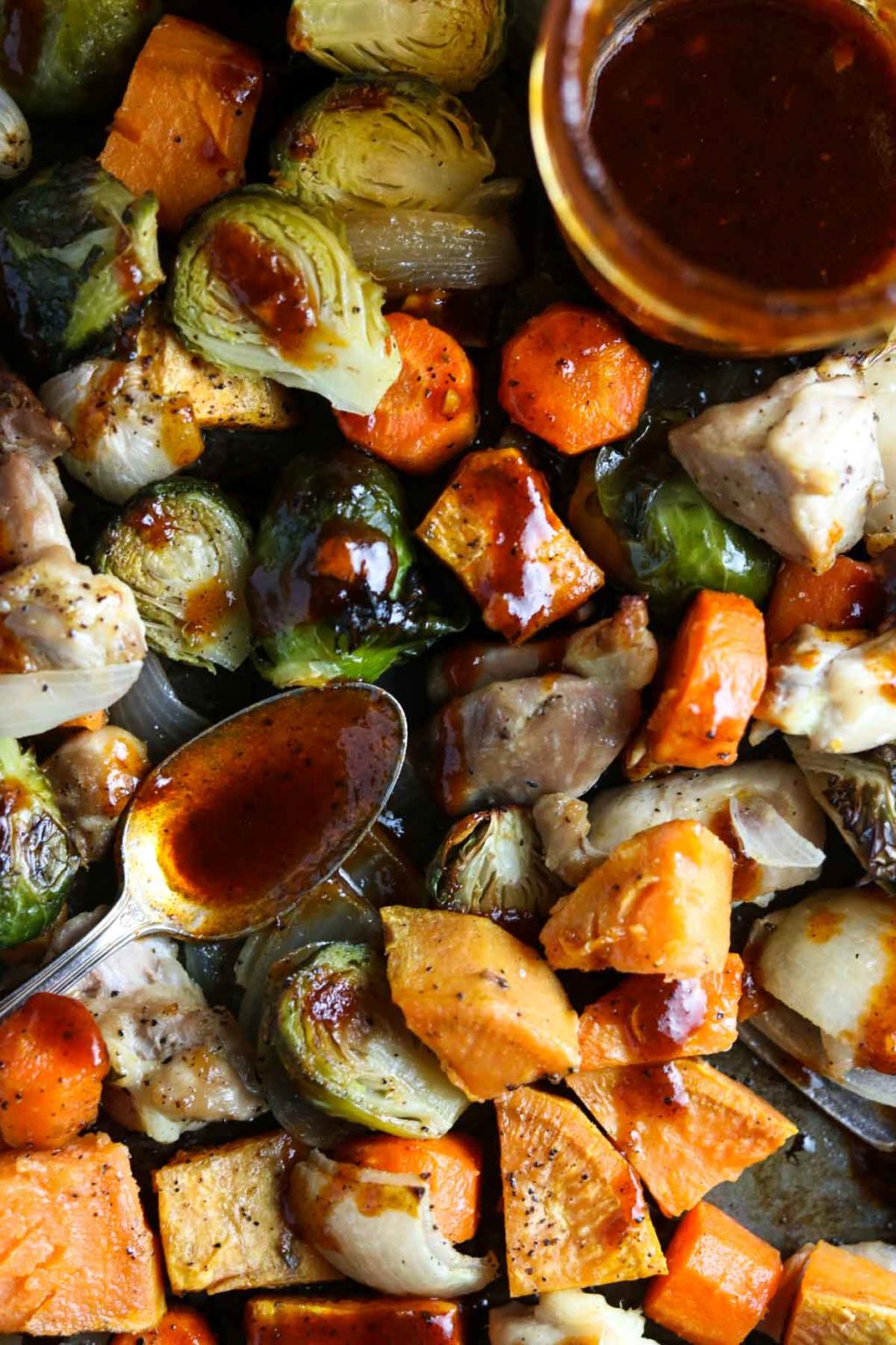 brussel sprouts, chicken, carrots, sweet potatoes, and onions drizzles with bbq vinaigrette
