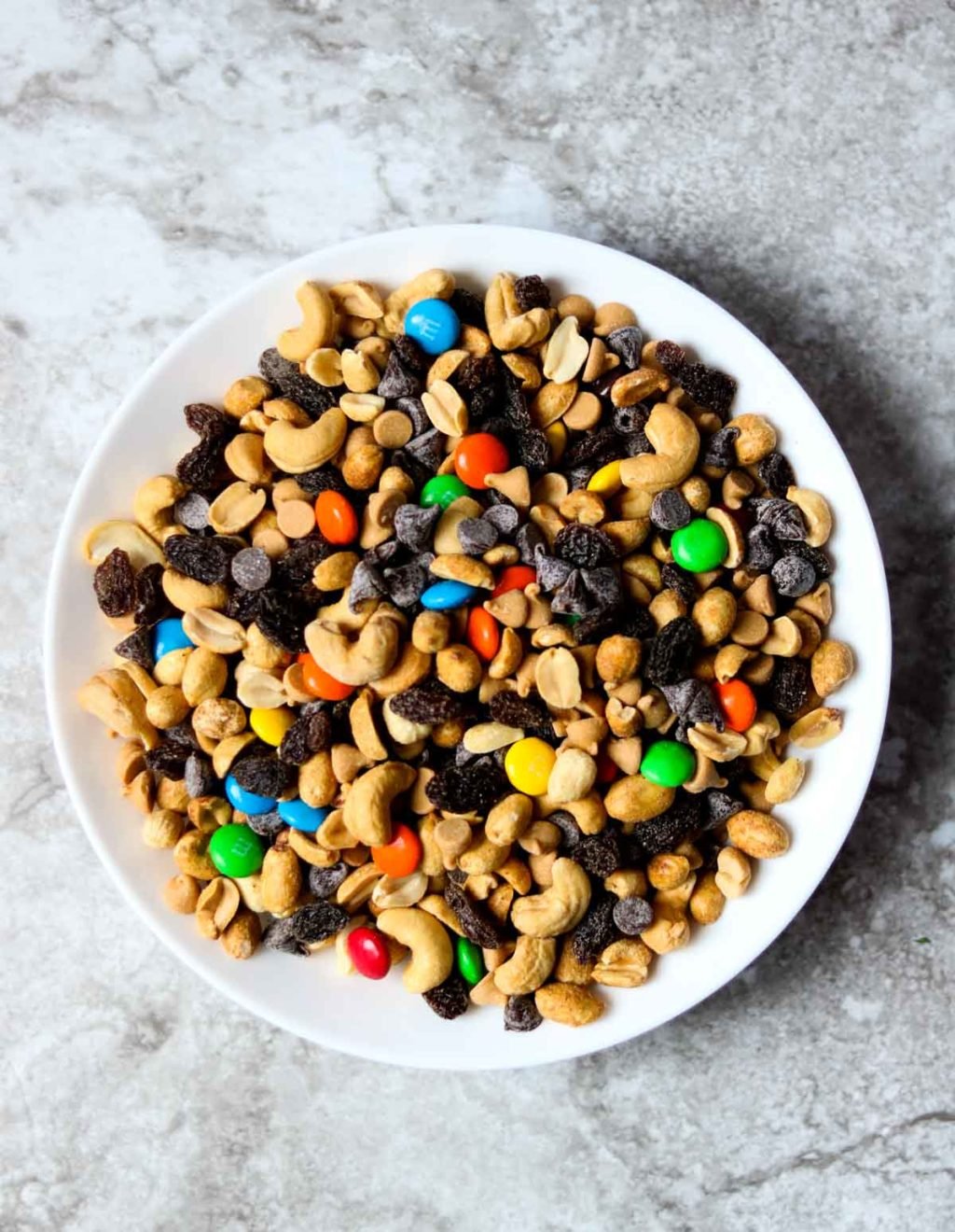 A white bowl of monster trail mix