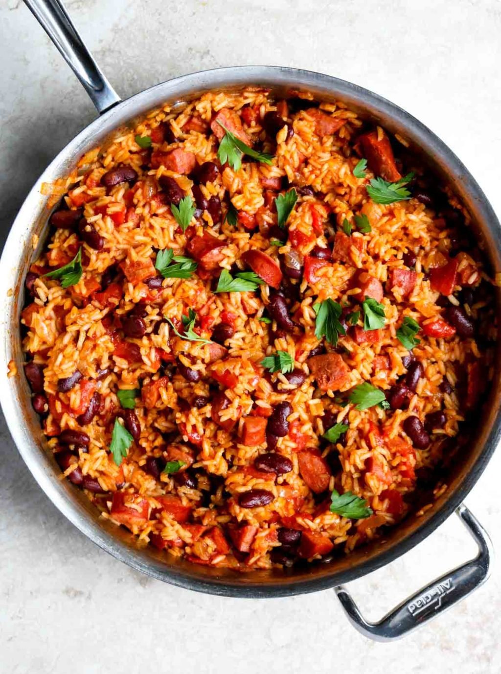 Skillet dirty rice and beans in an all-clad pan