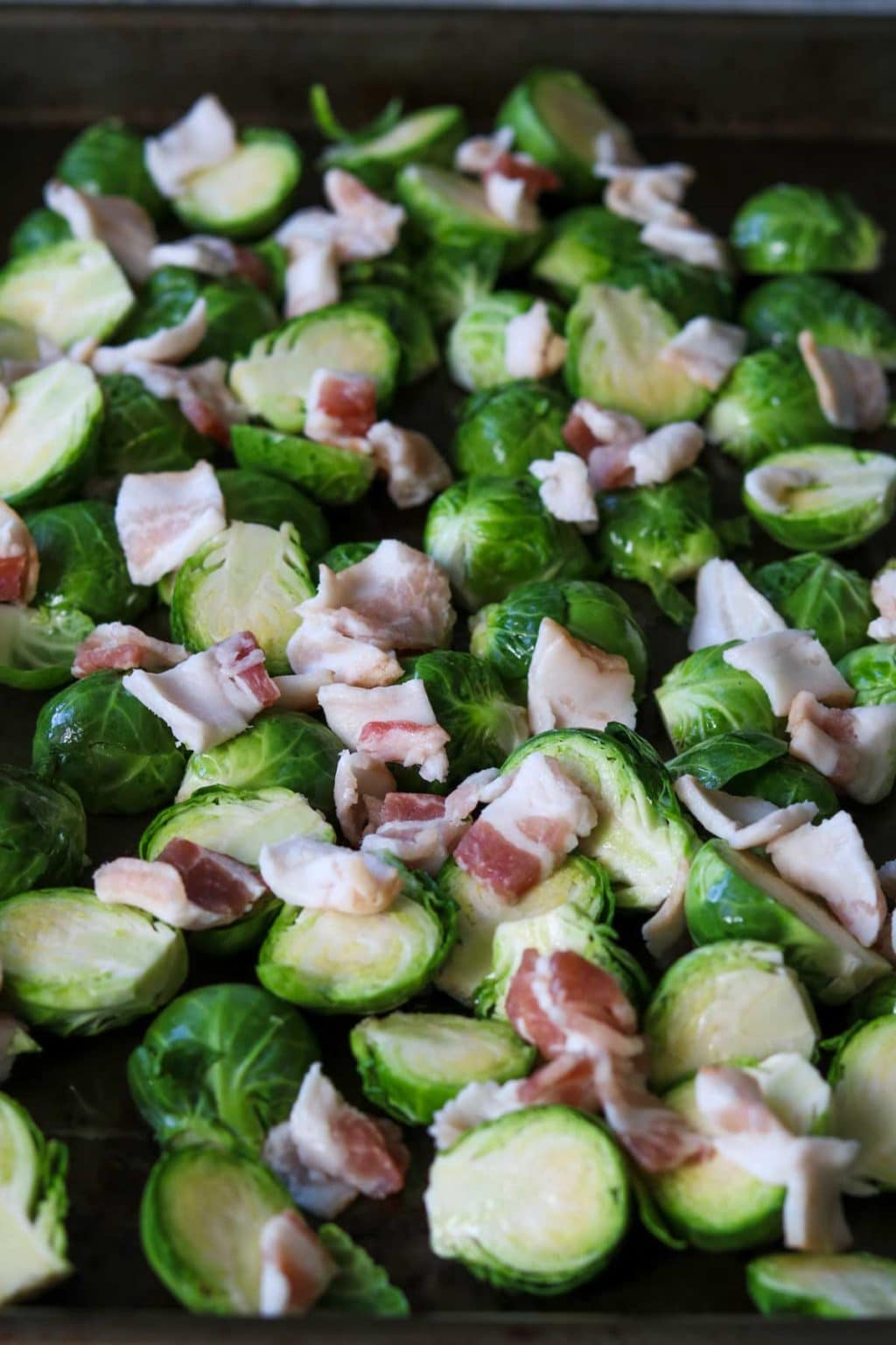 fresh brussels sprouts trimmed and topped with raw bacon