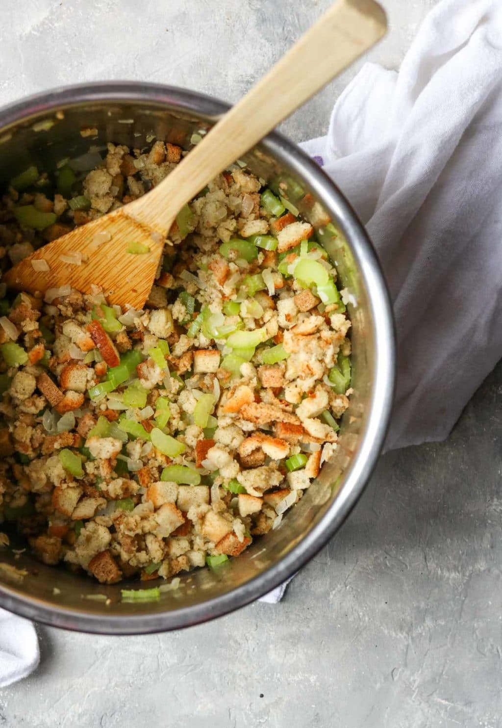 Stuffing in the instant pot with a wooden spoon
