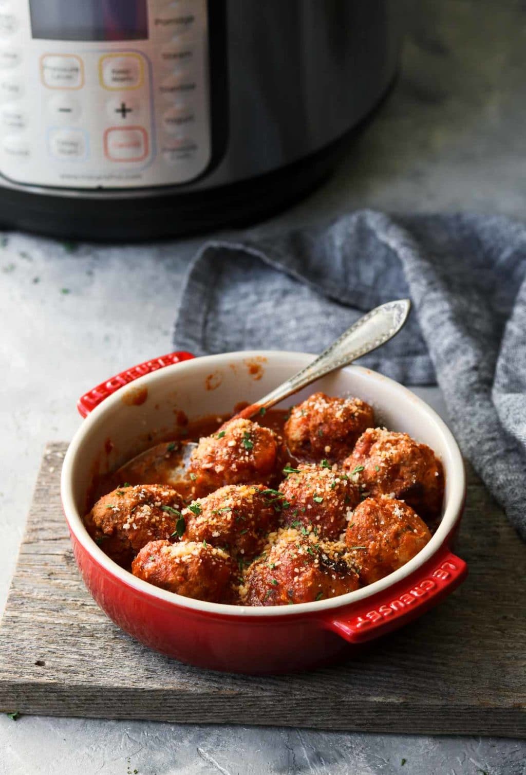 Instant Pot in the background , turkey meatballs in a red dish