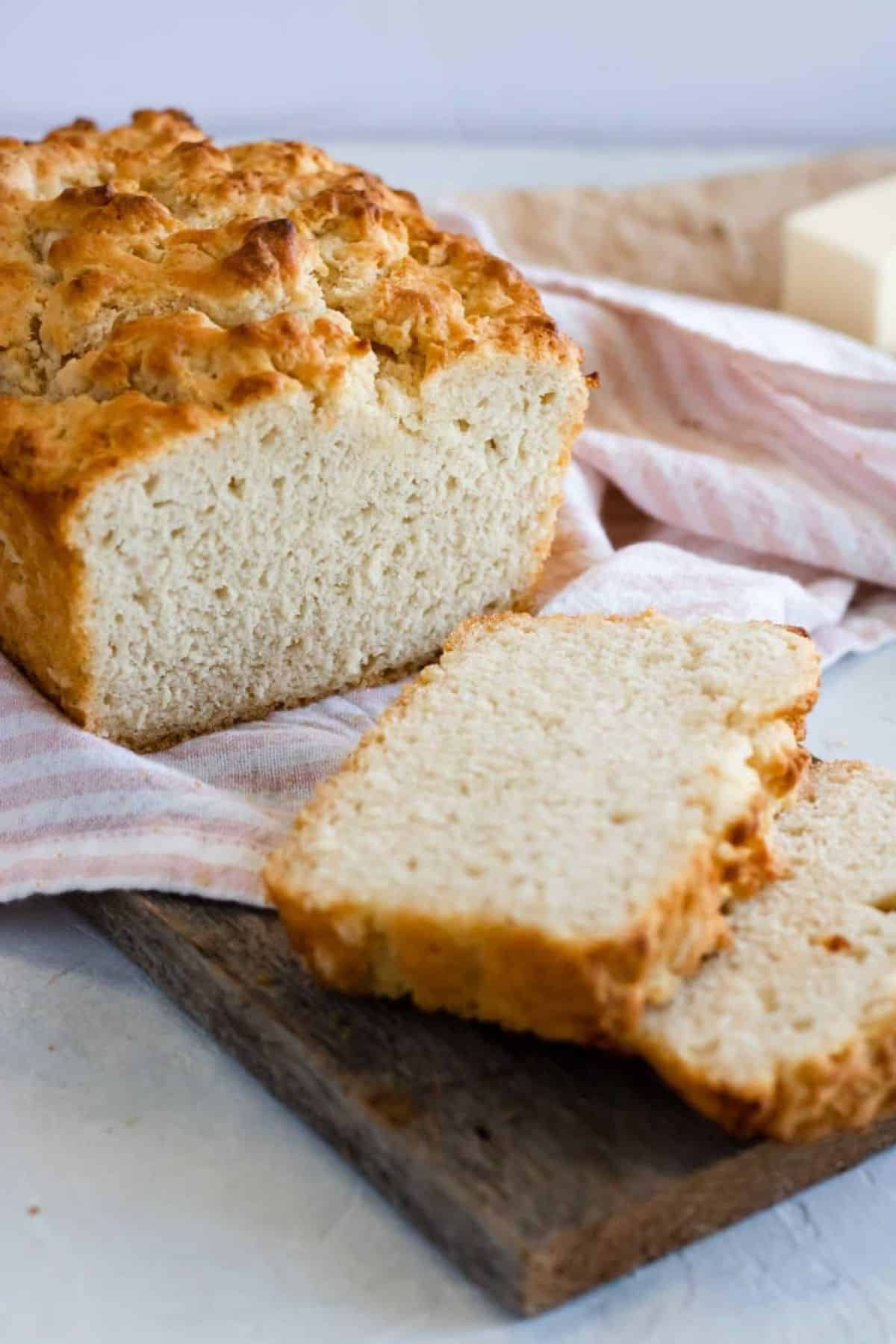 beer bread on a cutting board with slices