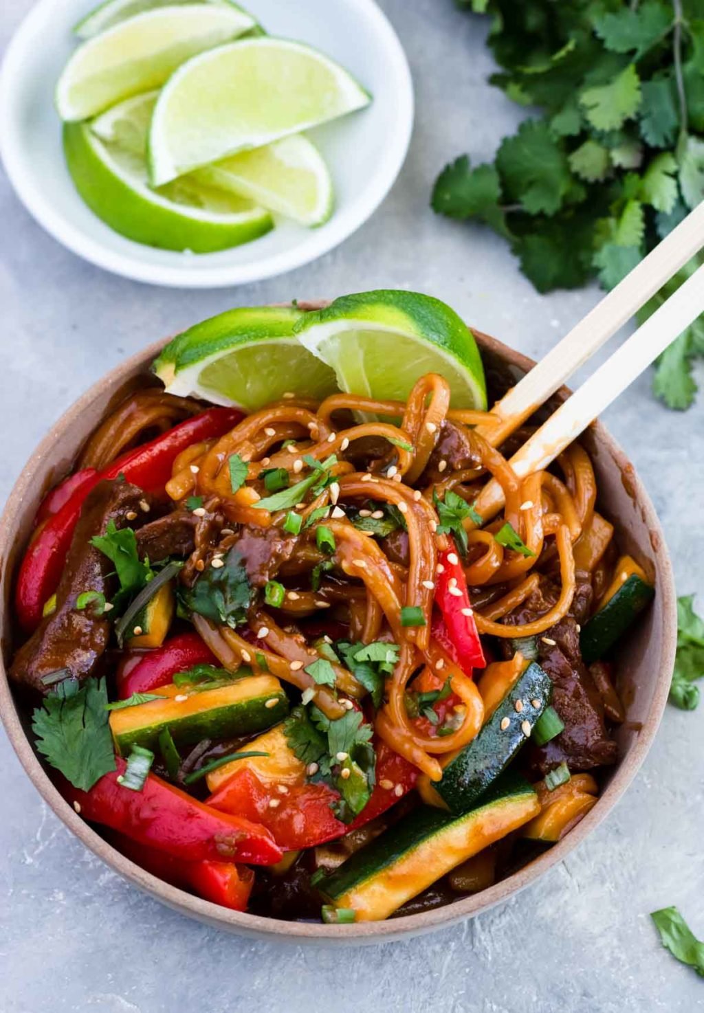 Instant Pot Teriyaki Beef Noodles in a bowl with chopsticks