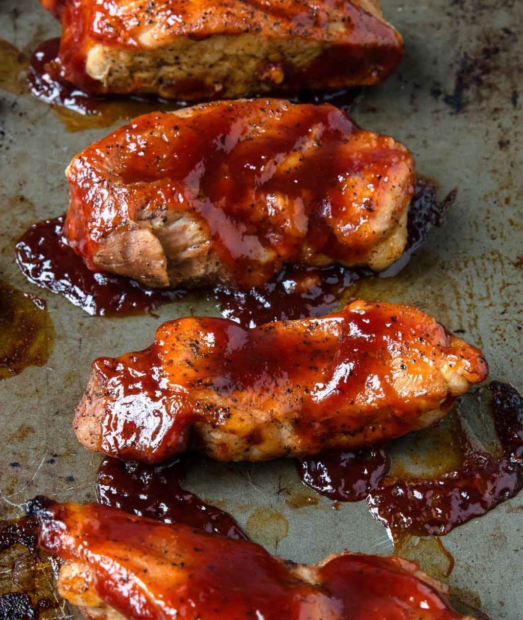 up close photo of boneless pork ribs coated with bbq sauce