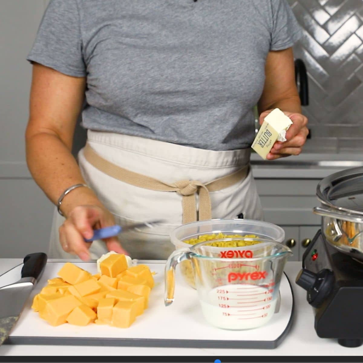 putting skillet mac and cheese on a cutting board 