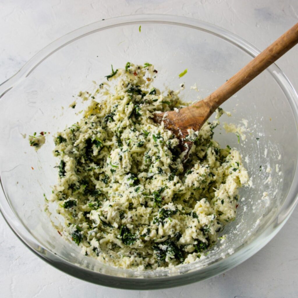 the filling all mixed together for stuffed shells with spinach and ricotta