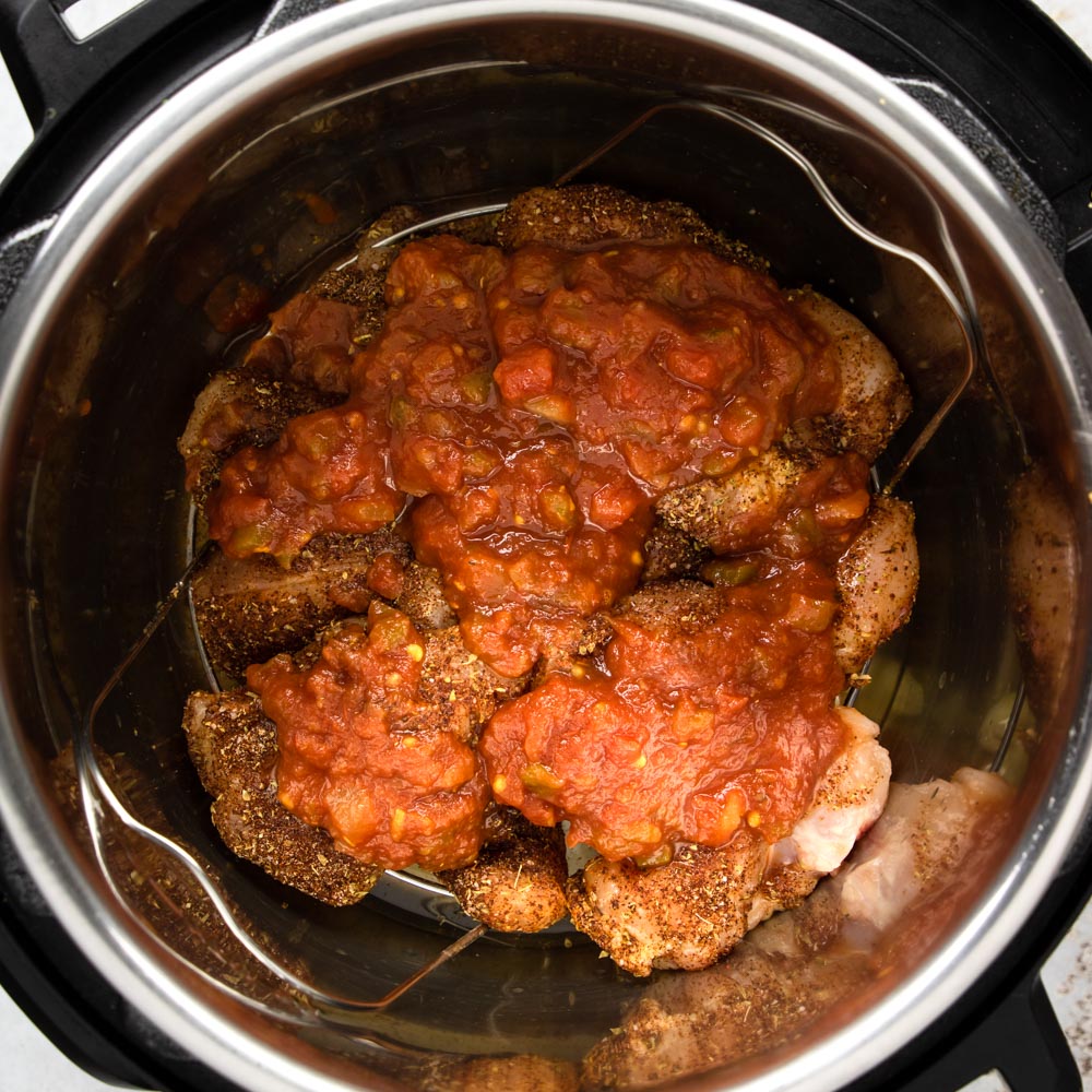 chicken topped with salsa in the instant pot