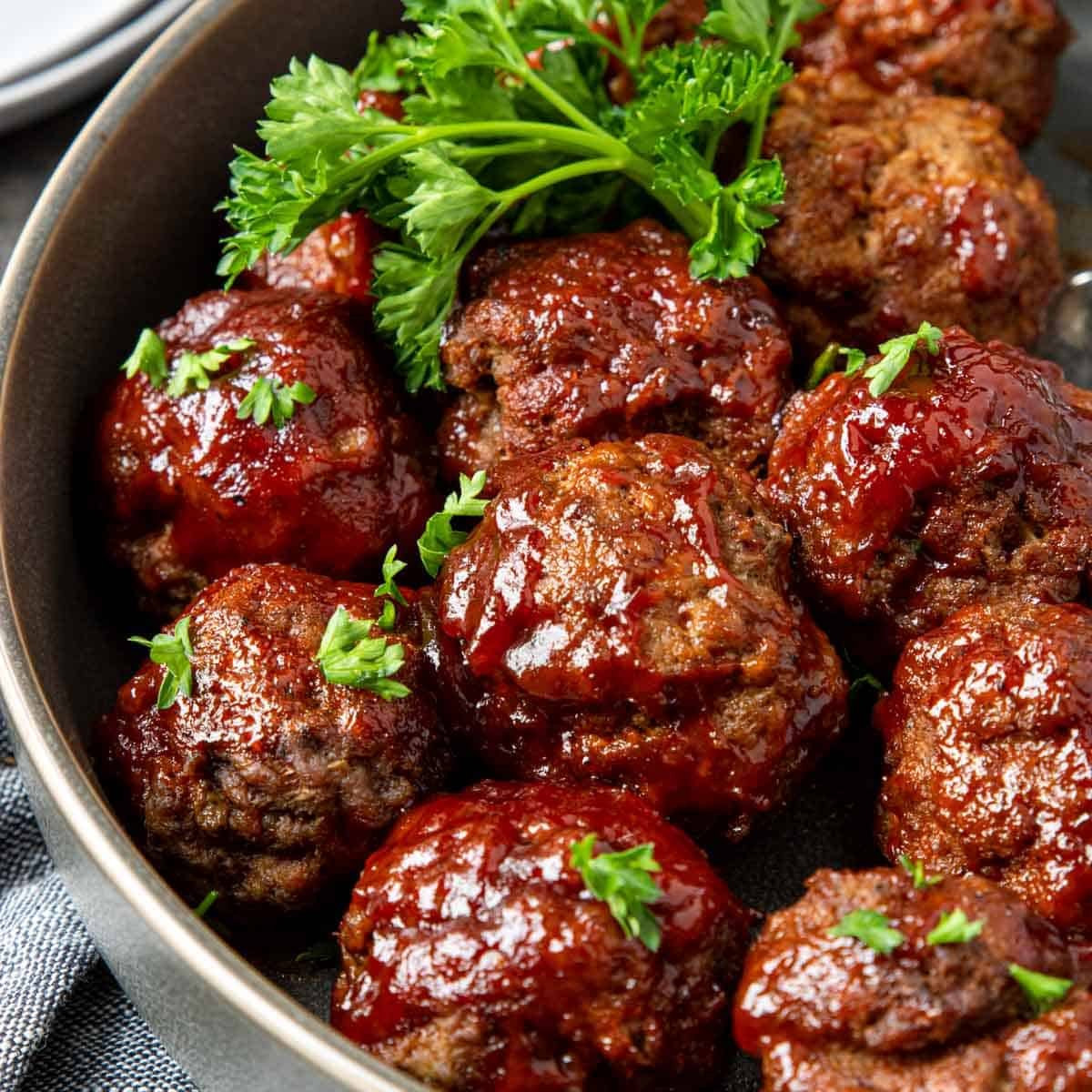 BBQ Meatballs in a bowl garnished with parsley