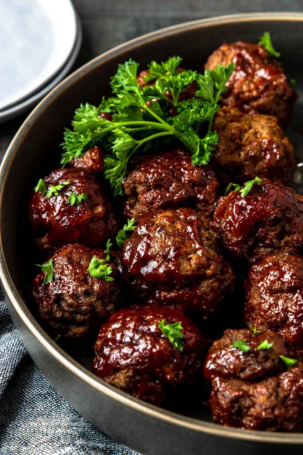 Instant Pot BBQ Meatballs in a dish garnished with parsley