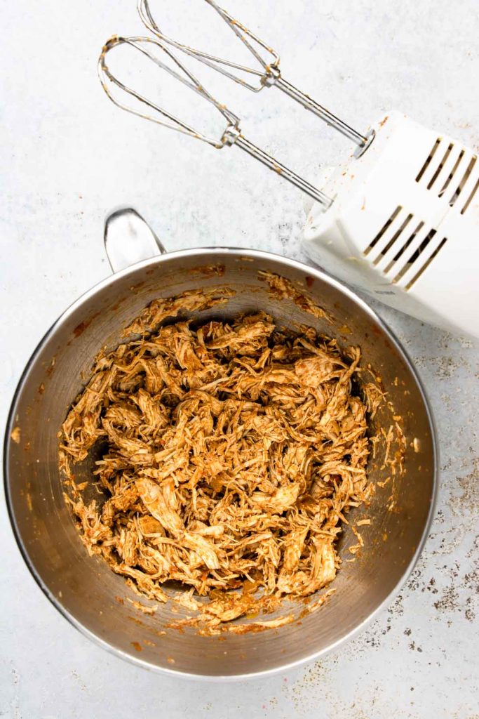 Chicken shredded for tacos using a hand mixer