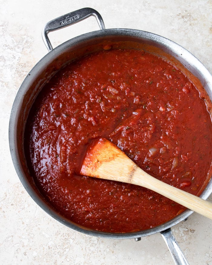 tomato red wine sauce in a pan for goat cheese chicken