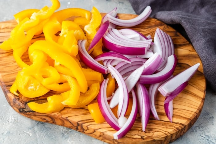 yellow peppers and red onions cut into strips