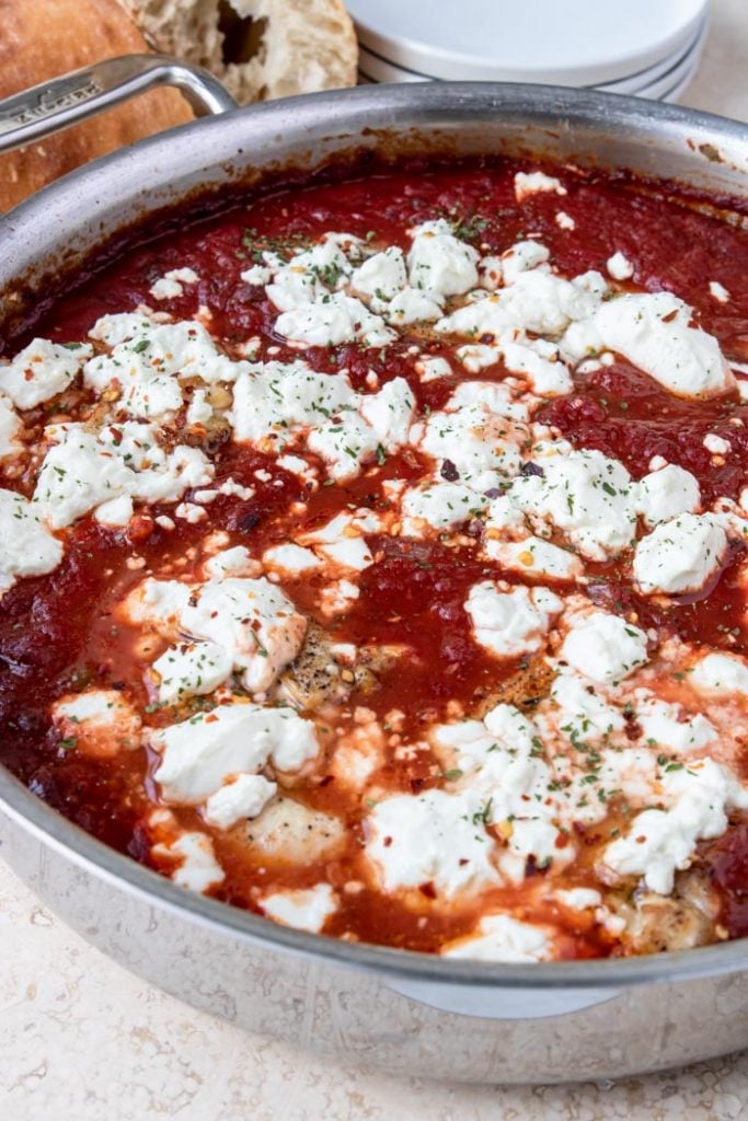 Chicken breasts in a tomato sauce topped with goat cheese