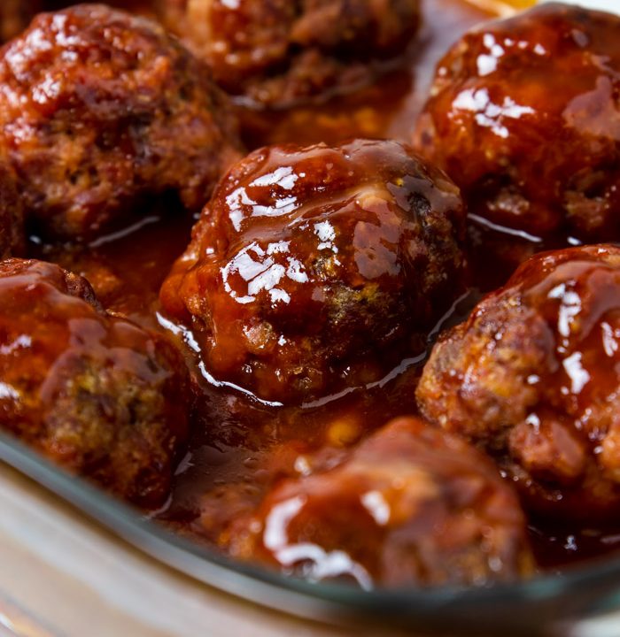 Ham Balls baked in a brown sugar and tomato sauce in a glass baking dish