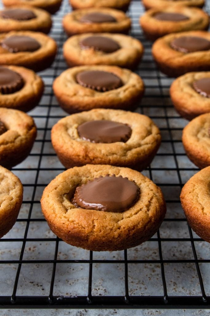 Reese's Peanut Butter Cup cookies cooling on a rack