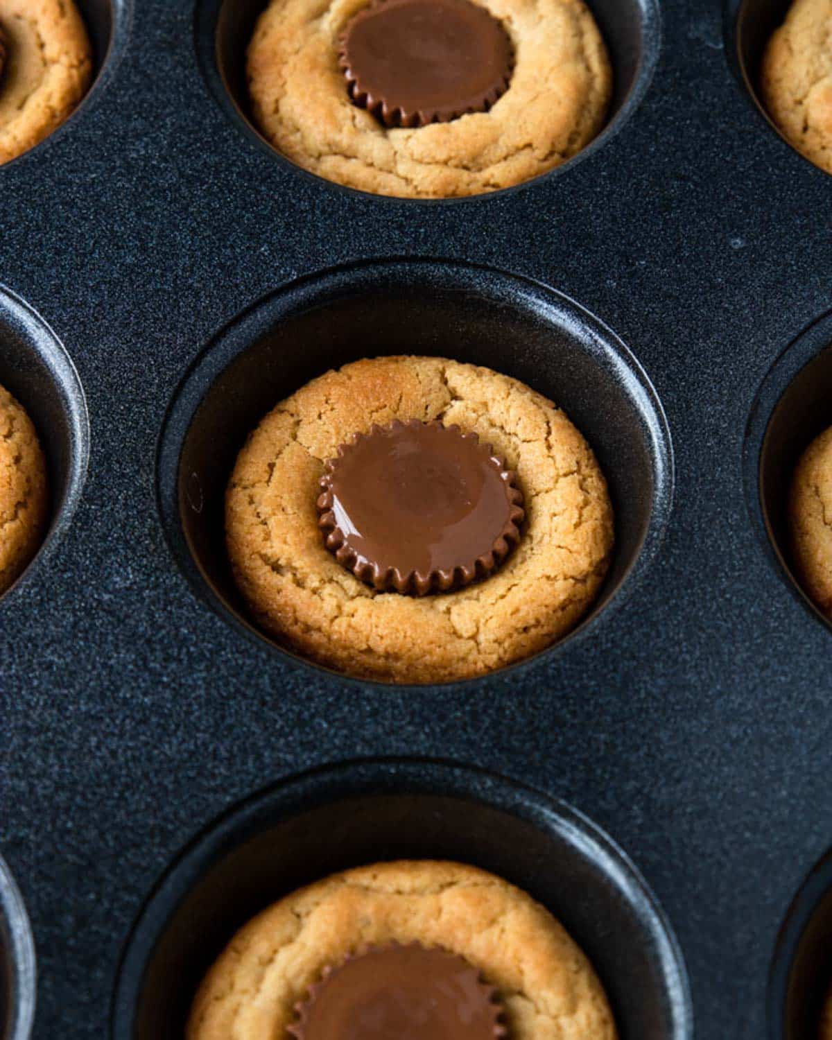 Reece's Peanut Butter Cup Cookie in a muffin tin